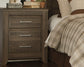 Juararo Queen Panel Bed with Mirrored Dresser and 2 Nightstands